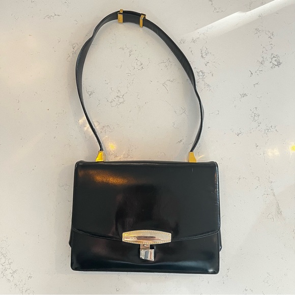 Koret Handbags - Koret Chic Black Leather Shoulder Bag with Red Inside and Gold Accents